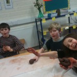 Warming the clay with our hands was hard work!